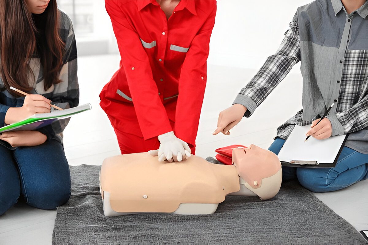 Instructor demonstrating CPR techniques during certification renewal class