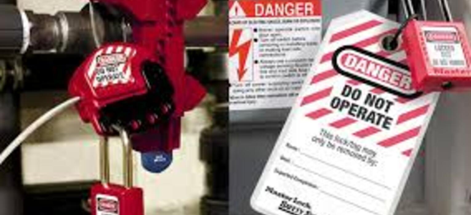 Lockout/tagout safety devices on machinery with a warning tag stating "Danger Do Not Operate," emphasizing OSHA compliance for authorized workers.