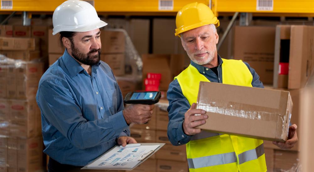 Safety Is A Mindset workers scanning packages in warehouse